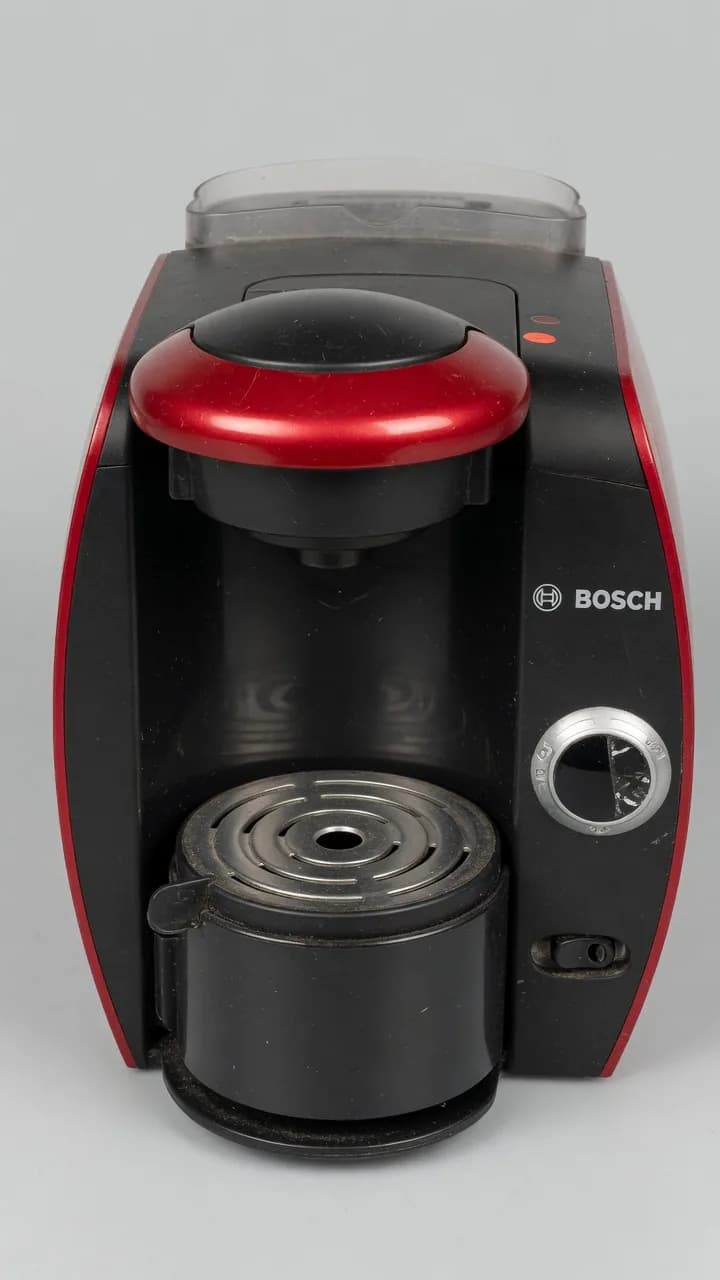 Used red and black Bosch capsule coffee machine
