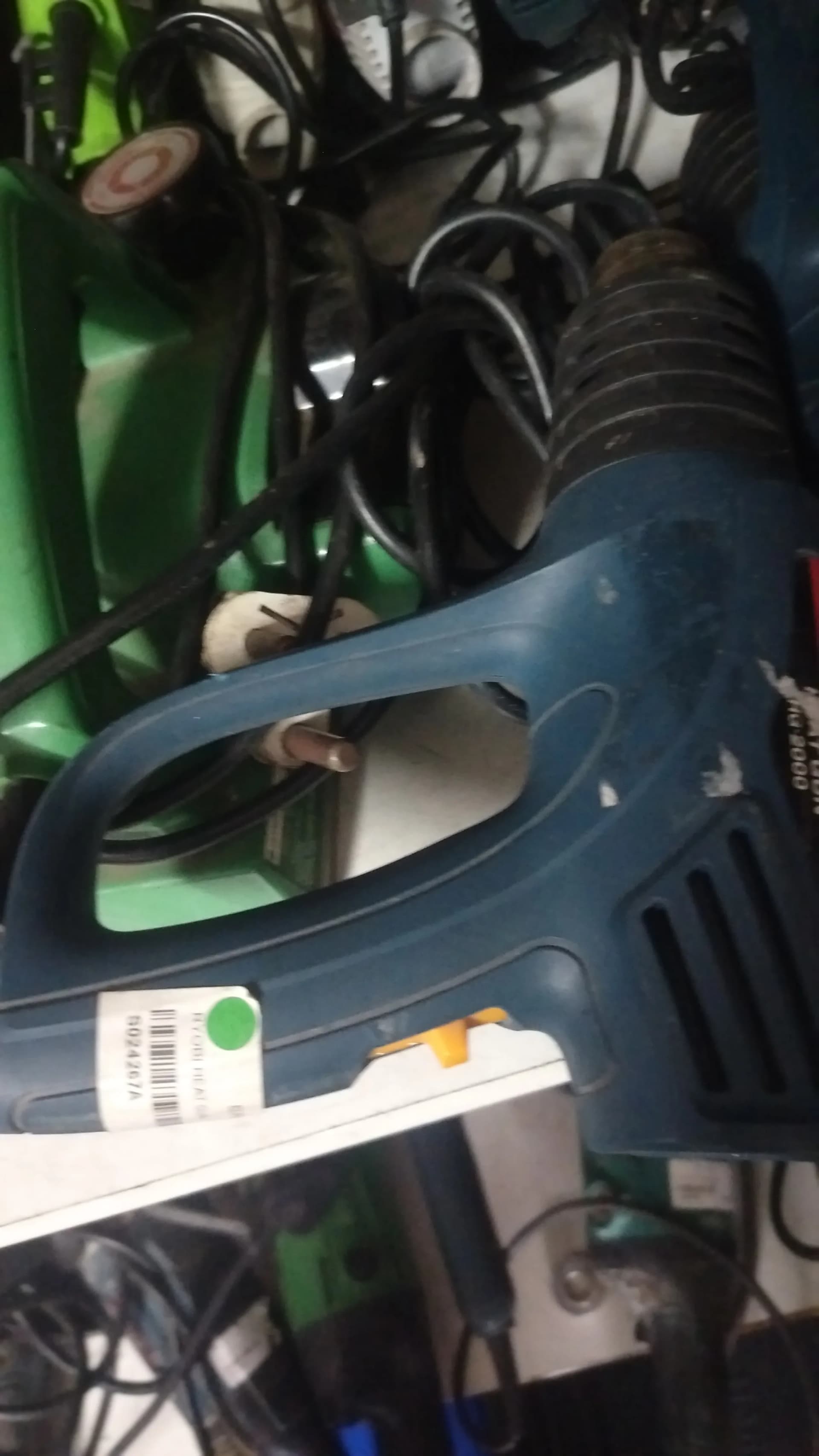 Handle of a used blue Ryobi heat gun