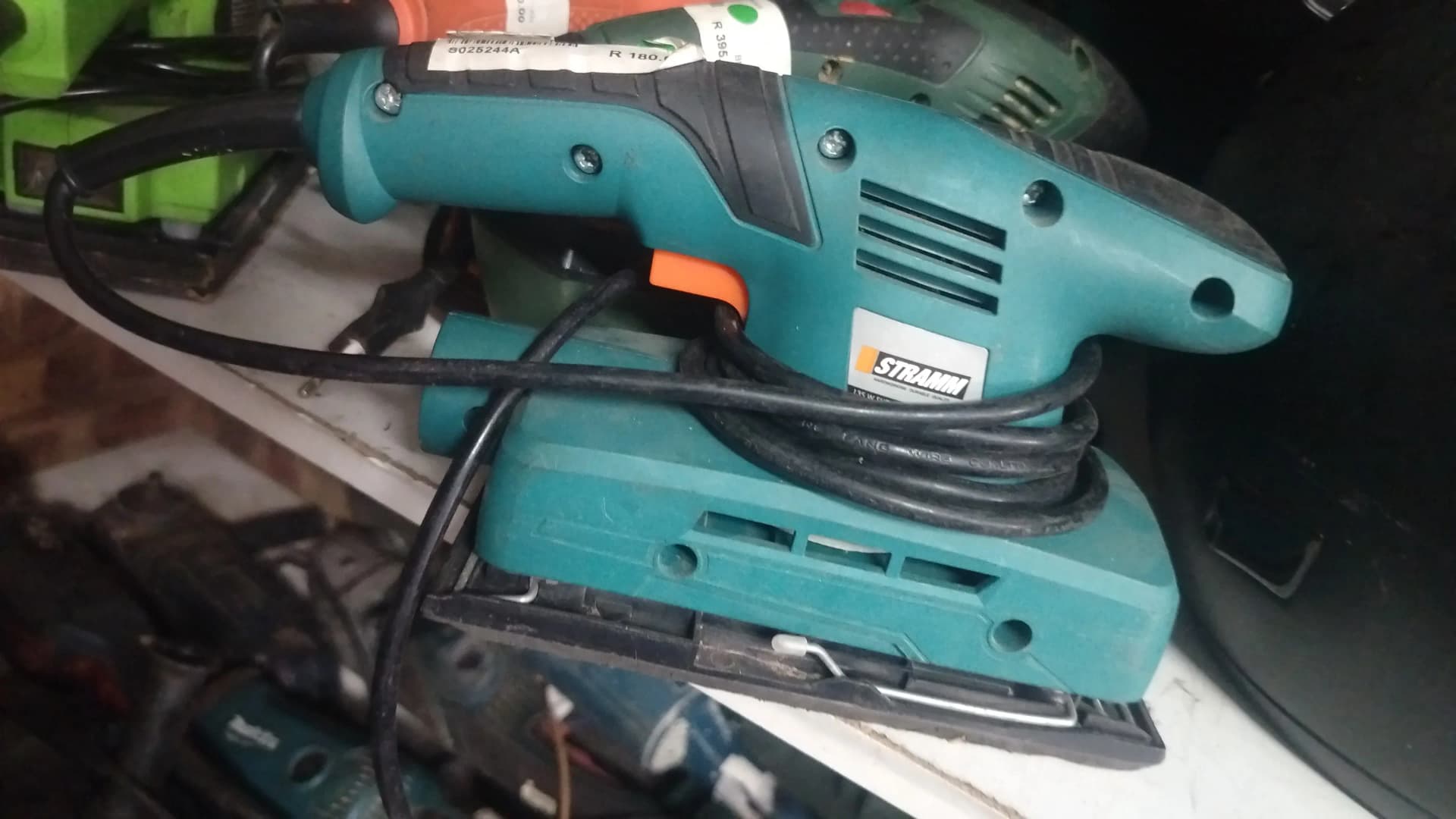 Used teal Stramm sheet sander with the lead wrapped around it