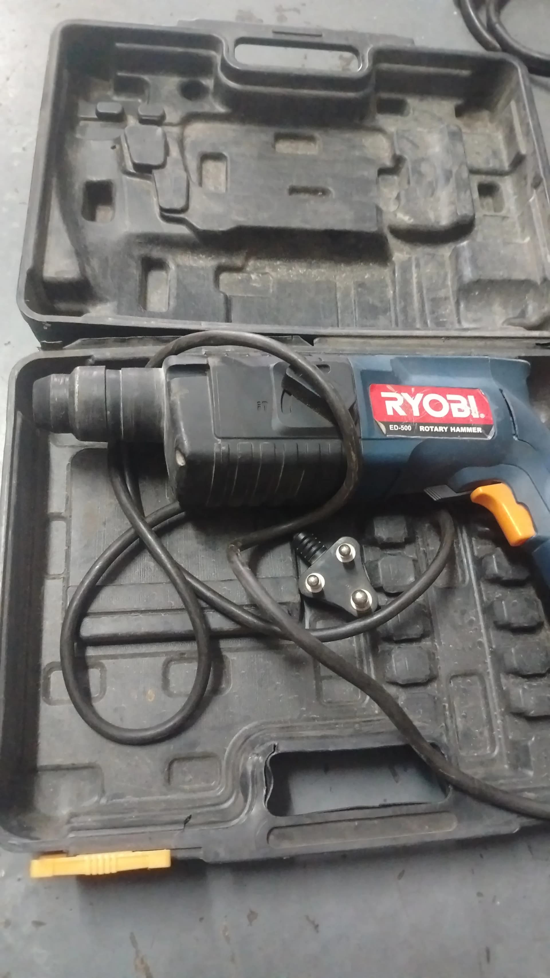 Used Ryobi ED-500 rotary hammer in an open case