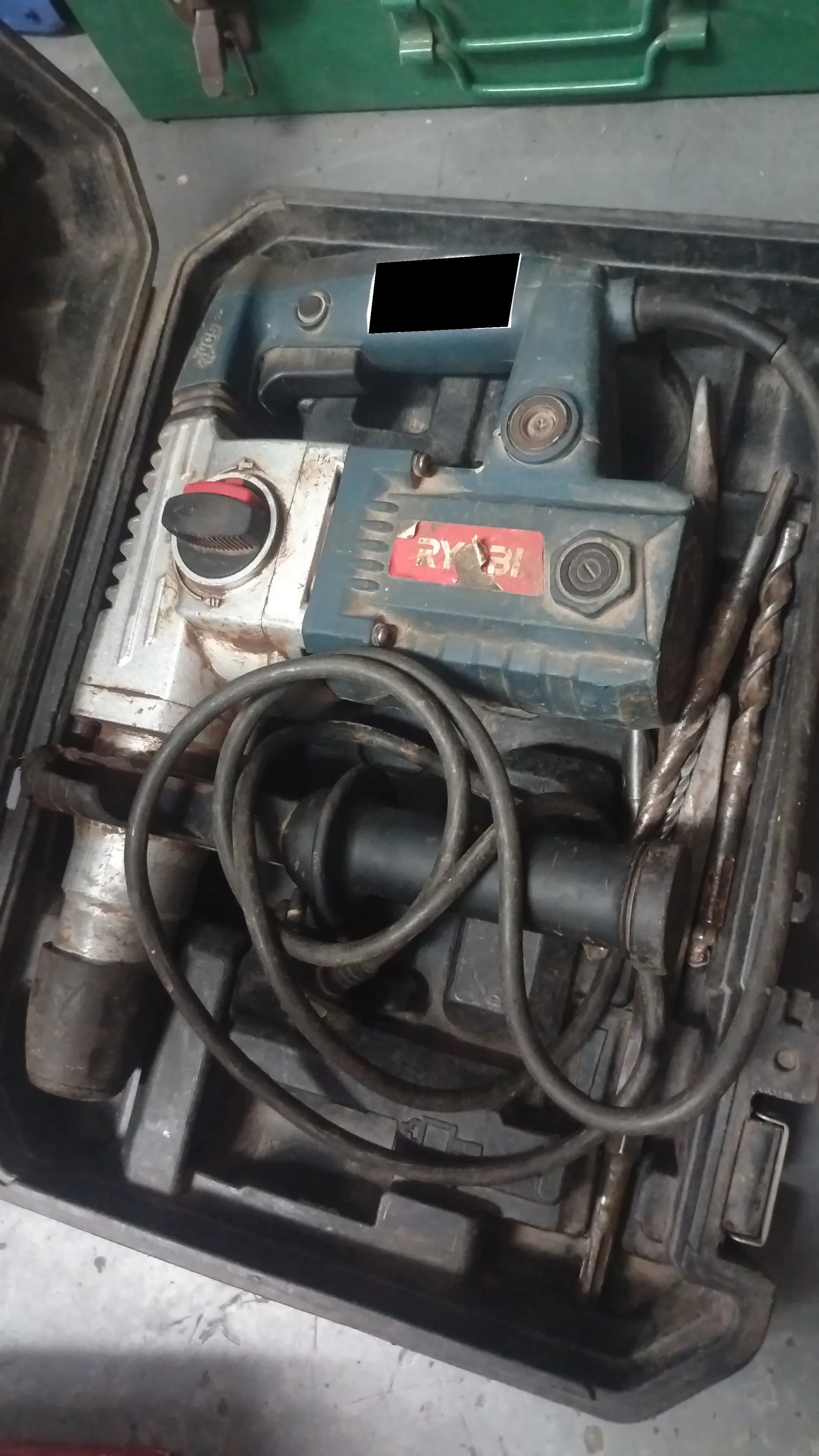 Used Ryobi hammer drill with bits in an open case