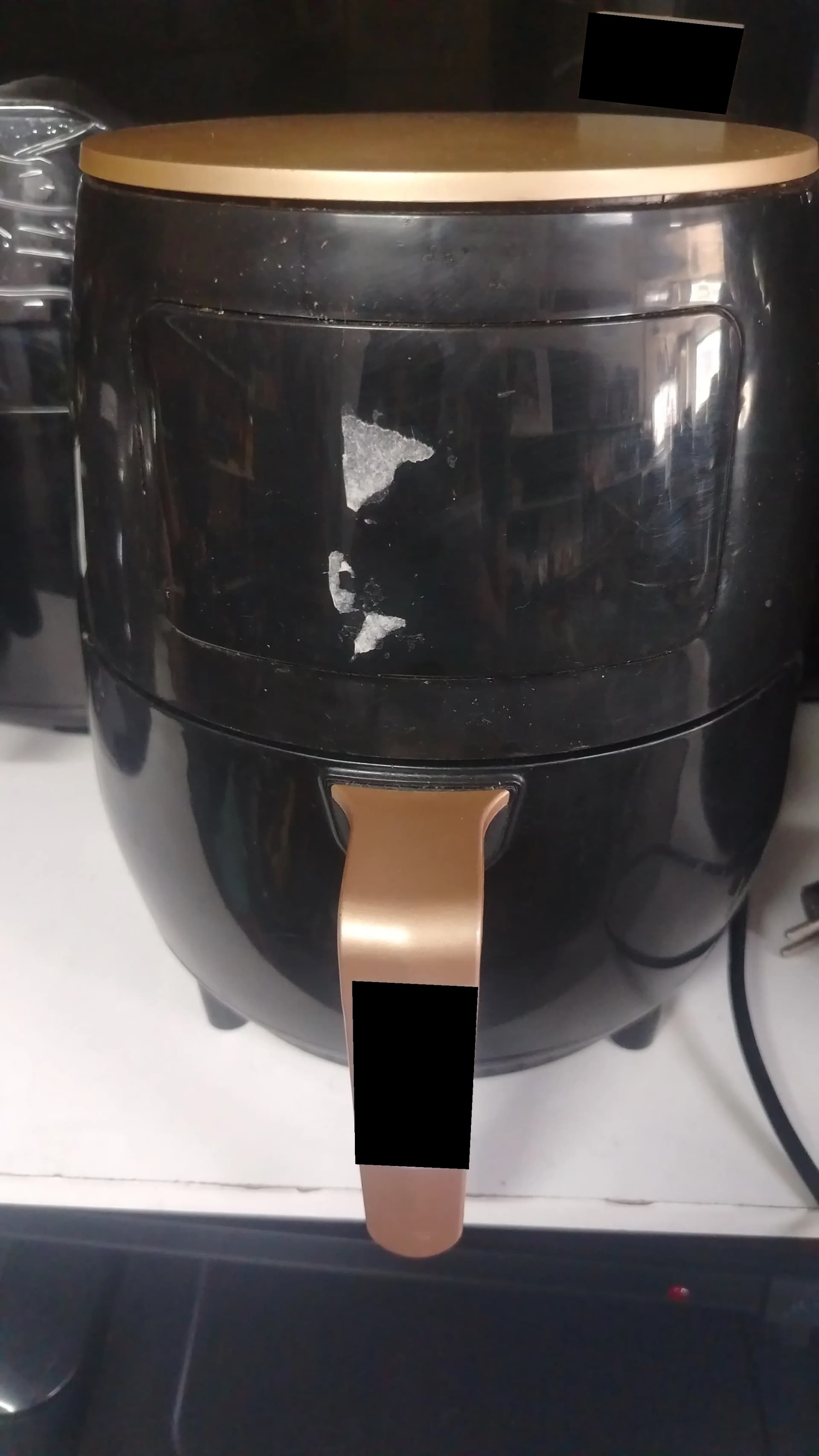 Used black Silver Crest air fryer with peeling coating on the front
