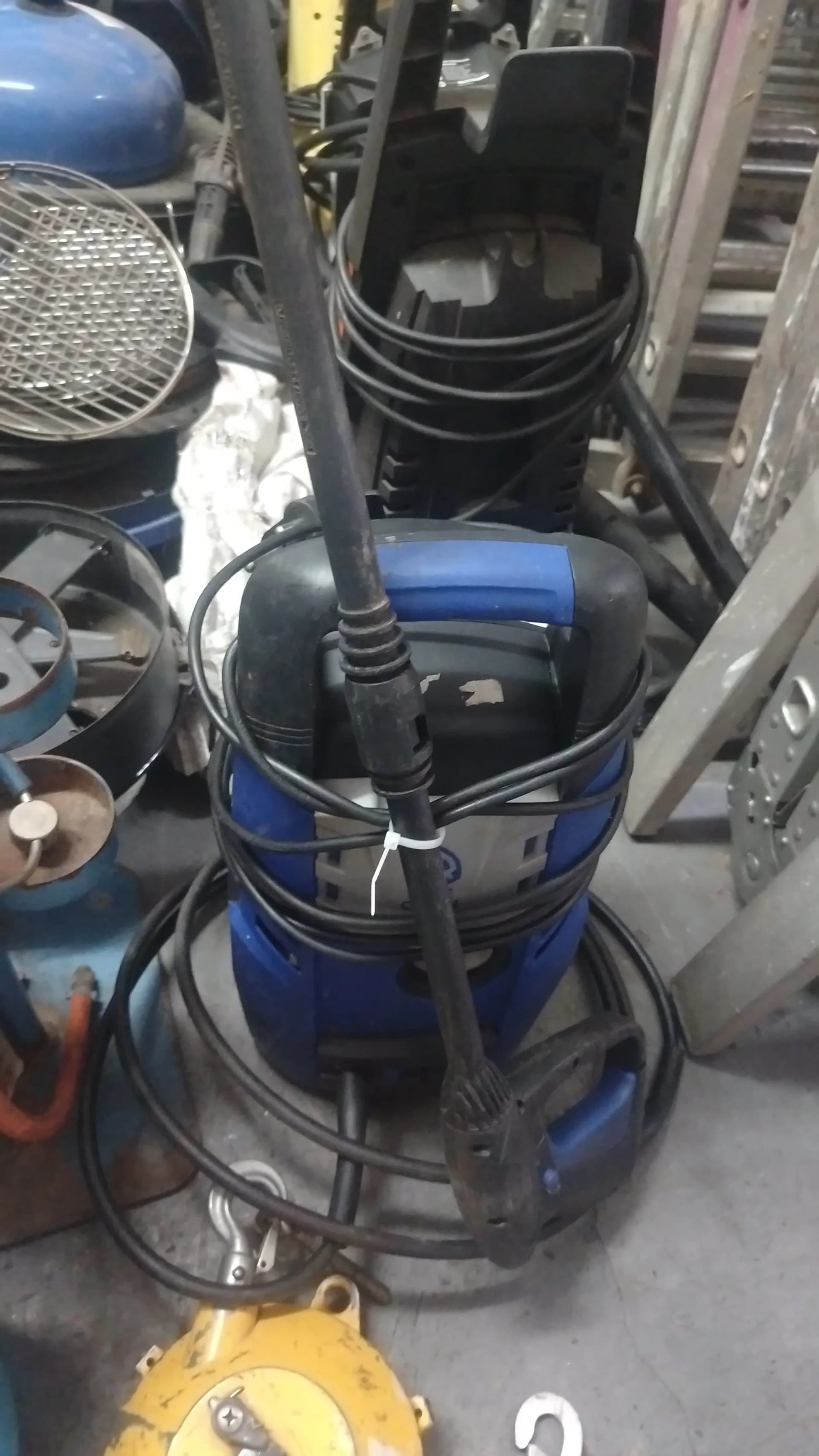 Used blue high pressure washer with hose, lance and gun