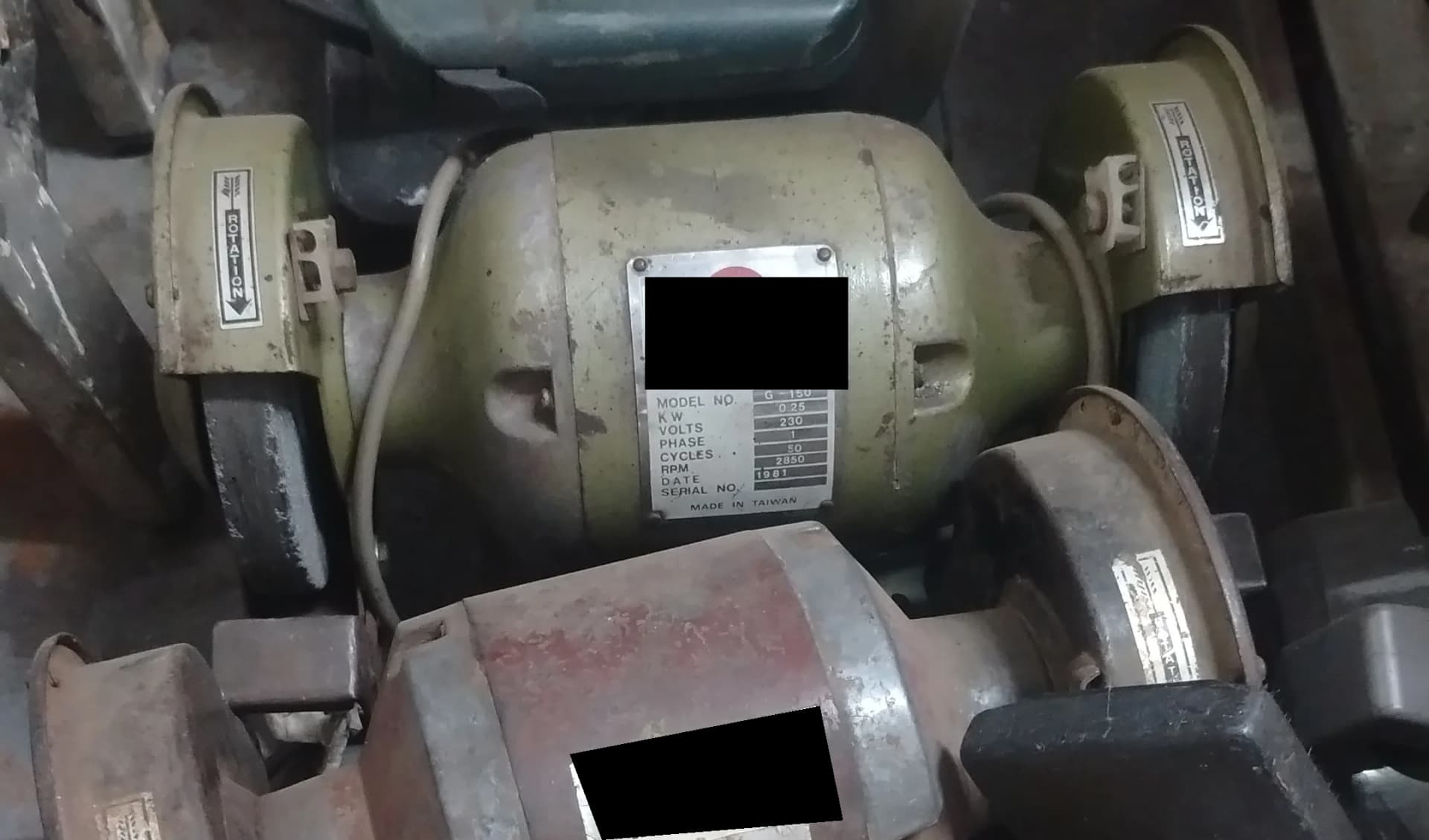Used green heavy duty bench grinder with two wheels