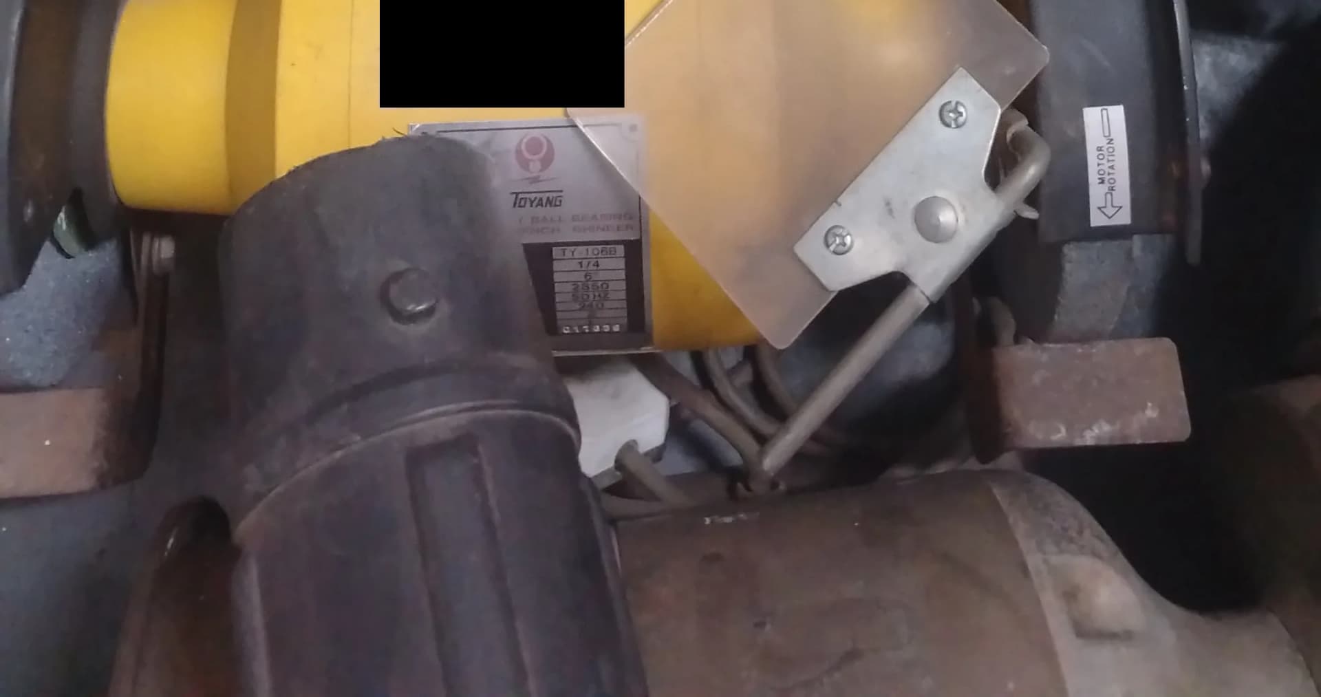 Used yellow Toyang TY1068 bench grinder