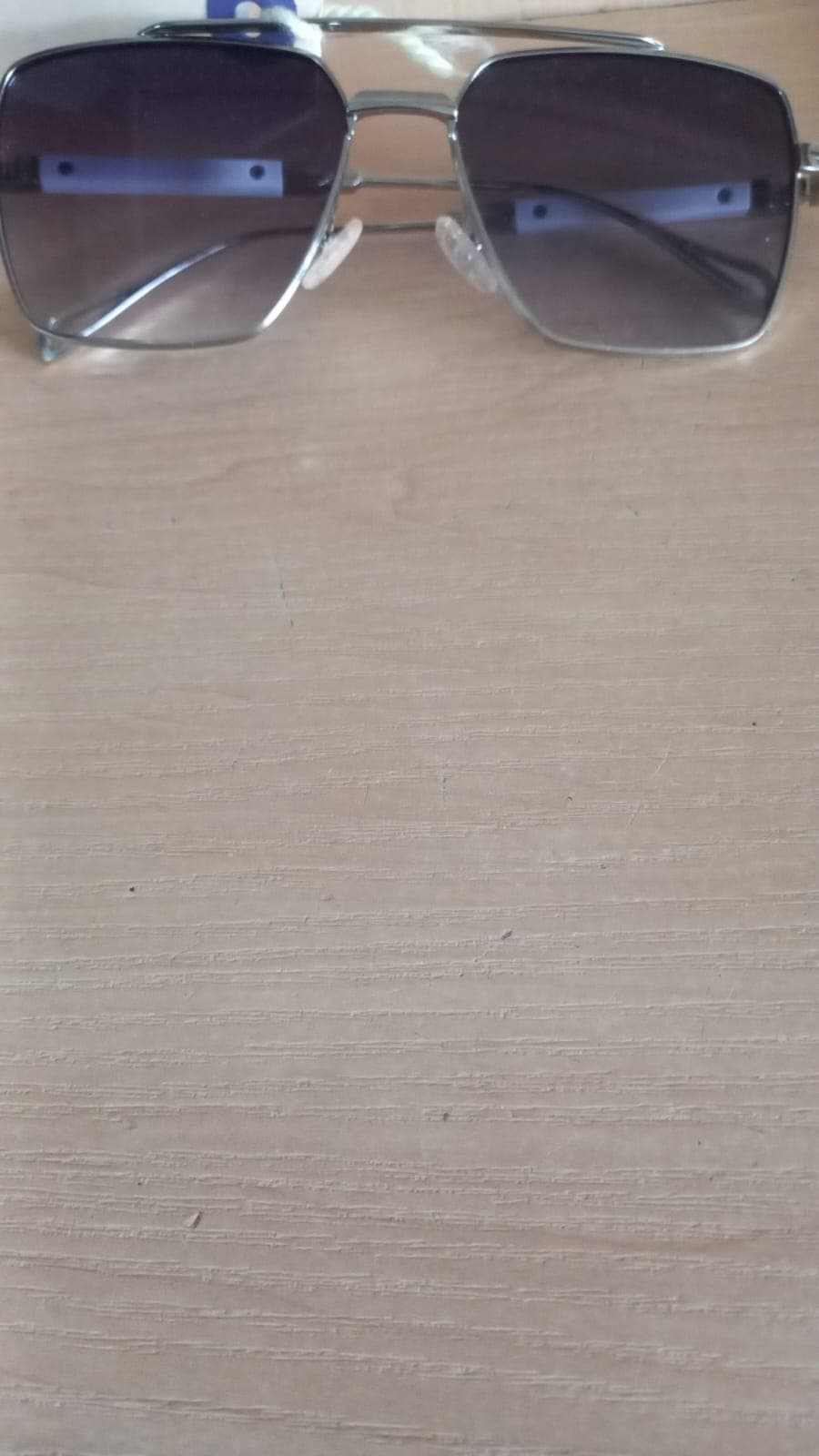 Silver-tone sunglasses with gradient lenses and case