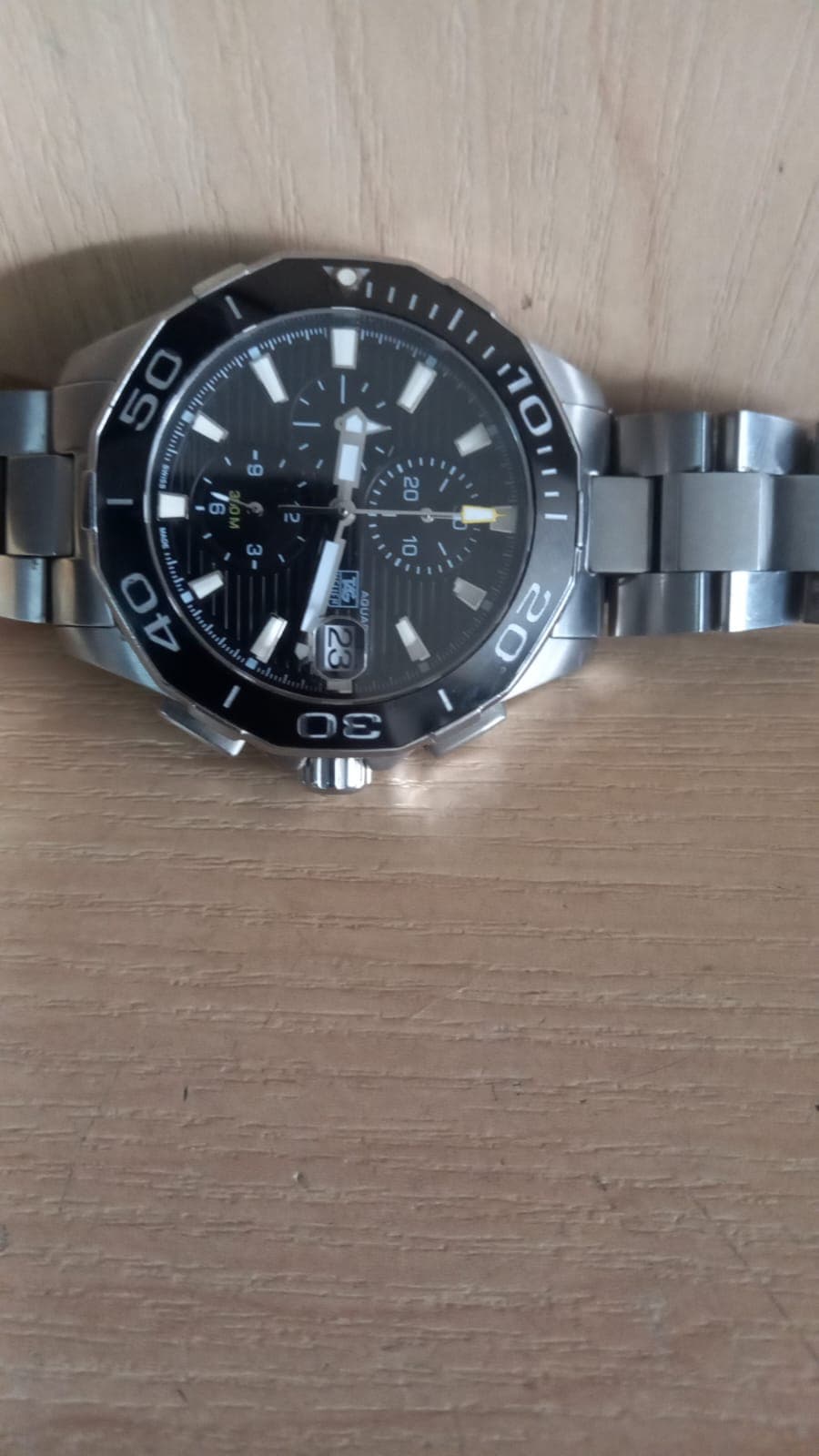 Black-dial bracelet watch — supplier-labelled replica